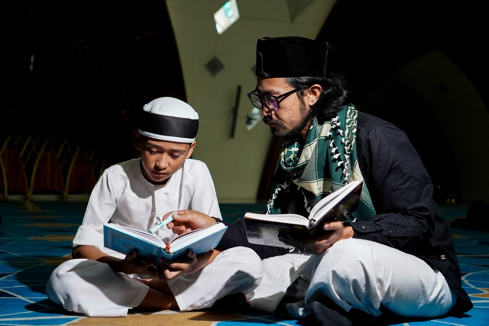 Young student holding the Holy Quran